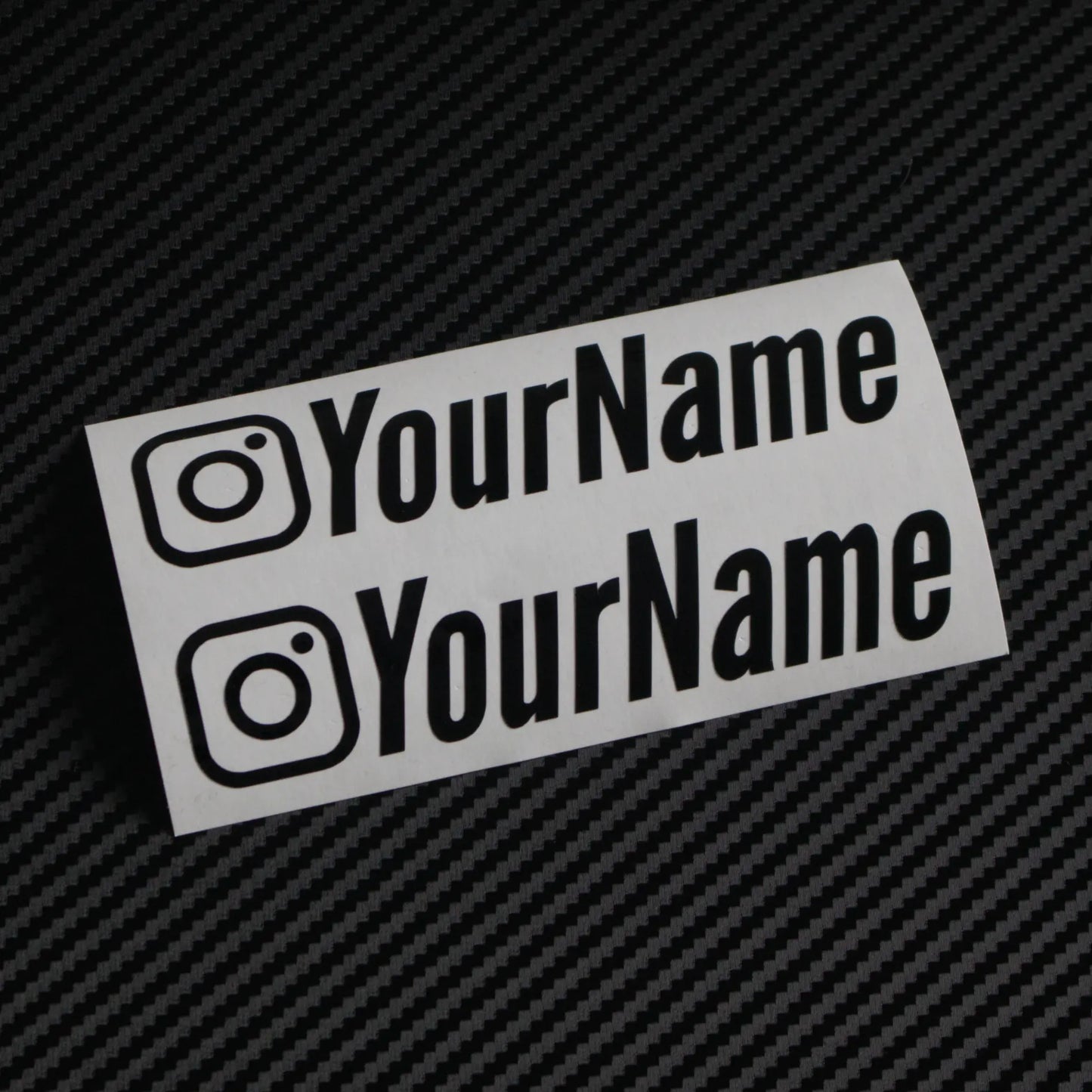 Gloss Instagram car sticker decal on carbon fibre background